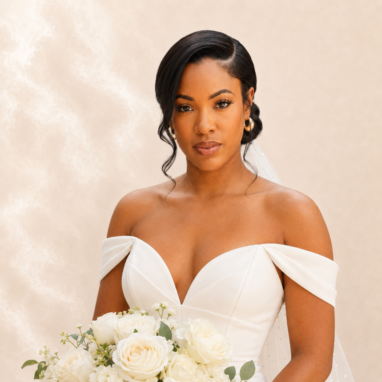 Bride in off-shoulder gown with sleek low bun and veil holding a white rose bouquet